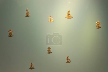 Photo for Tadpole golden figures into a golden museum showcase - Royalty Free Image