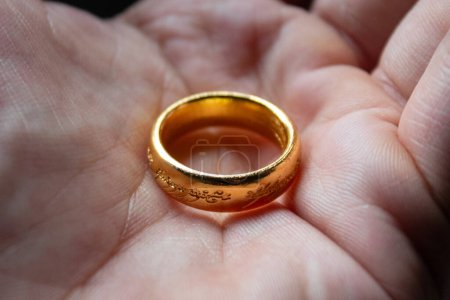 Photo for The one ring of Lord of the rings movies over a male hand - Royalty Free Image