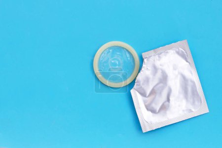 Photo for Condom on blue background. Copy space - Royalty Free Image