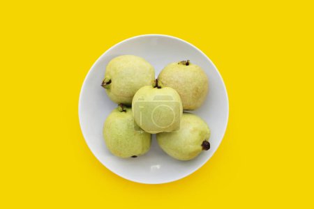 Photo for Fresh pink guava on yellow background. - Royalty Free Image