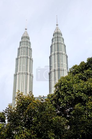 Photo for Kuala Lumpur, Malaysia - January 2023: Petronas towers are the world's tallest twin skyscrapers and remained as the tallest buildings in Malaysia until 2019 - Royalty Free Image