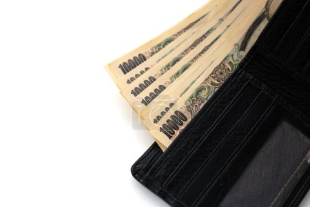 Billetera negra con billetes de diez mil yenes, billetes de yen japoneses
