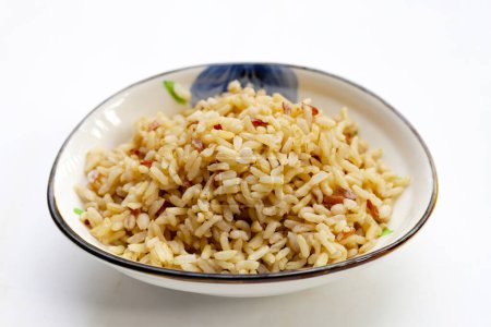 Cooked brown rice on white background.