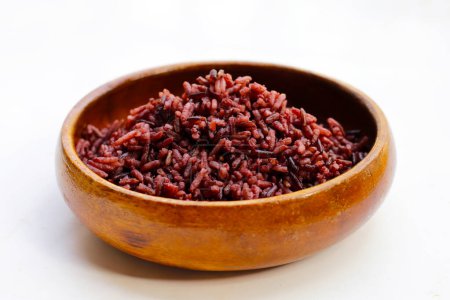  Cooked black berry rice in wooden bowl