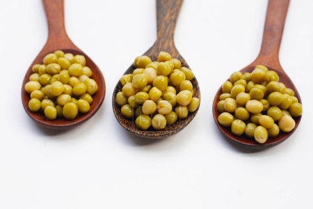 Canned green peas on white background.