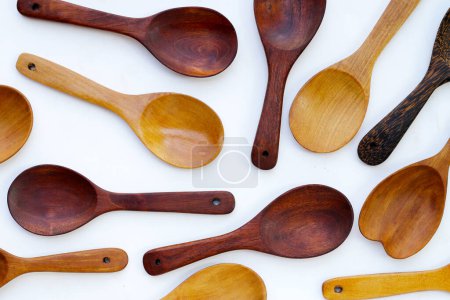 Wooden spoon on white background.