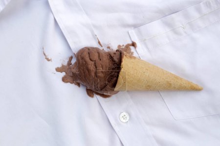 Dirty stain chocolate ice cream  on white clothes