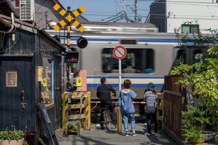 Photo for People waiting for train to pass, Kamakura - Royalty Free Image