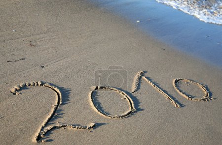 Photo for Number 2010 written in the sand of a beach - Royalty Free Image
