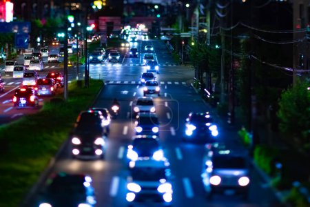 A night miniature traffic jam at the downtown street in Tokyo. High quality photo. Nishitokyo district Higashifushimi Tokyo Japan 09.30.2022 Here is a city street in Tokyo.