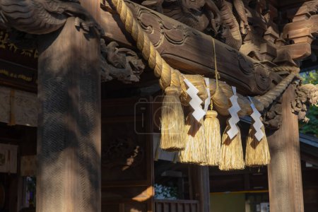 Photo for A sacred rope in front of the temple at Japanese Shrine. High quality photo. Nishitokyo district Tanashi Tokyo Japan 10.20.2022 It is used for separating a holy place from other unclean places. - Royalty Free Image
