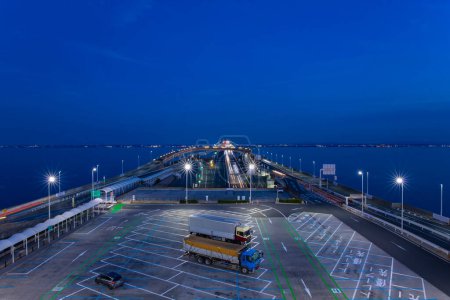 A dusk traffic jam on the highway at Tokyo bay area in Chiba. High quality photo. Kisarazu district Chiba Japan 01.30.2024 Here is the highway parking called UMIHOTARU PA in Chiba Japan.