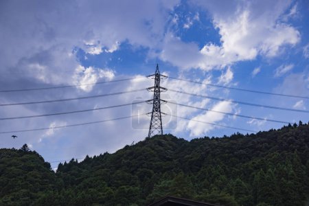 A power line on the mountain at the countryside in Nakanojo Gunma. High quality photo. Agatsuma district Nakanojo Gunma Japan 07.20.2023