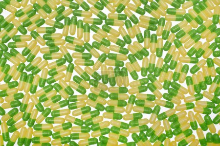 Photo for Filled background of green-yellow capsules - Royalty Free Image