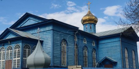 Photo for Old wood blue Orthodox church with a golden dome, Tubil`tsi, Cherkasy region - Royalty Free Image