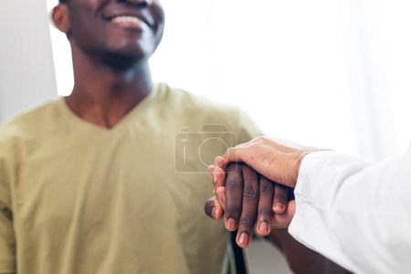 Photo for Friendly doctor hands holding patient hand support and hope concept. - Royalty Free Image