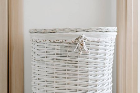 Photo for White wicker laundry basket at home. High quality photo - Royalty Free Image