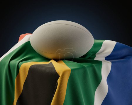 Téléchargez les photos : Un ballon de rugby régulier reposant sur un drapeau sud-africain drapé sur un socle sur un fond de studio isolé - rendu 3D - en image libre de droit
