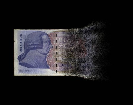 Foto de A concept image showing a half dissolved flat paper UK pound bank note on a dark studio background - 3D render - Imagen libre de derechos