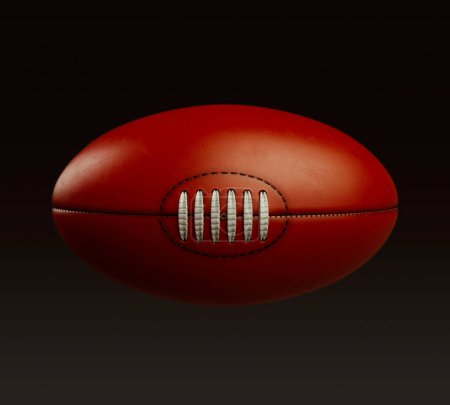 Photo for A generic unbranded aussie rules football ball on an isolated dark studio background - 3D render - Royalty Free Image