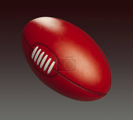 Photo for A generic unbranded aussie rules football ball on an isolated dark studio background - 3D render - Royalty Free Image