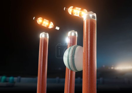 Téléchargez les photos : Une boule de cricket blanche frappant des guichets de cricket électroniques orange avec des cloisons délogantes et des lumières LED sur un fond de ciel nocturne - rendu 3D - en image libre de droit