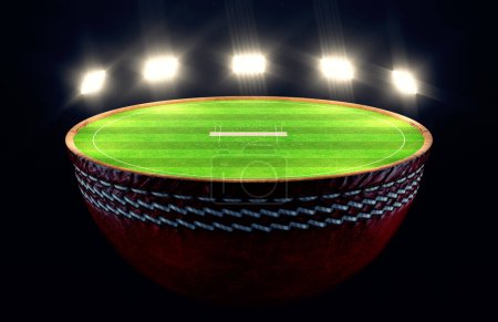 Téléchargez les photos : Un ballon de cricket divisé en deux révélant un champ de cricket en herbe verte marquée et un terrain avec des guichets la nuit sous des projecteurs éclairés - rendu 3D - en image libre de droit