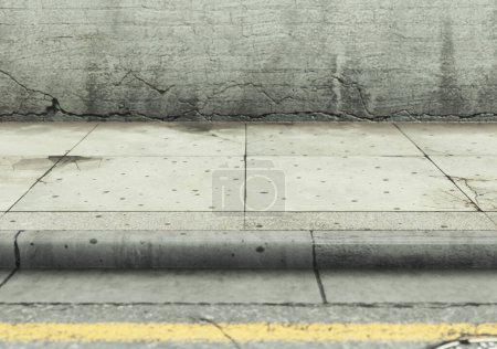 Téléchargez les photos : Une section au niveau des yeux d'une rue vide usée et grincheuse, trottoir pavé et mur de briques vierges à la lumière du jour - rendu 3D - en image libre de droit
