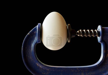 A concept image of a worn blue vintage-styled G-clamp holding a regular chicken egg on an isolated black studio background - 3D render