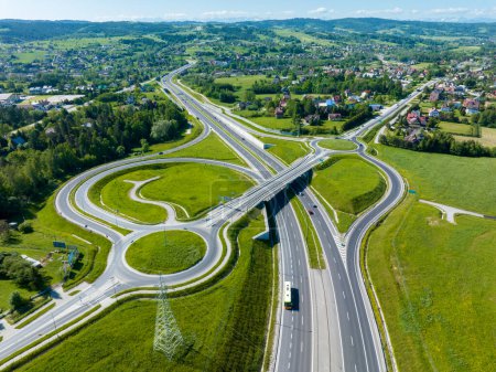New motorway junction in Poland on national road no 7, E77, called Zakopianka.  Overpass crossroad with traffic circles, slip ramps and viaducts near Rabka. Road to Slovakia to the right