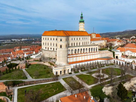 Mikulov castle in South Moravia, Czech Republic. Build  on a rock. Originally medieval, reconstructed in 18th century and renovated in 1950s. Aerial view with arcades, garden and town