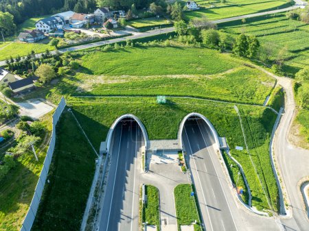 New tunnel on Zakopianka highway in Poland opened in November 2022. The tunnel is over 2 km long and makes travel to Zakopane, Podhale region and Slovakia much faster. Old road above. Aerial view