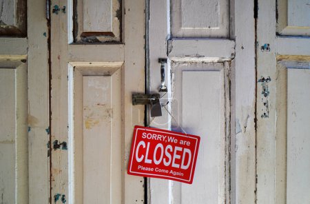 Photo for Sorry, We are Closed, Please Come Again sign at wooden door - Royalty Free Image