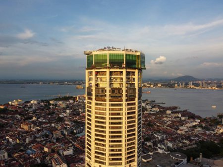 Photo for George Town, Penang, Malaysia - Jun 07 2022: Aerial view sun light evening at Komtar building and heritage George Town building at back - Royalty Free Image