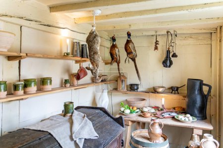 Photo for Pantry with game birds and hare hanging inside the birthplace of William Shakespeare in Henly Street, Stratford upon Avon, Warwickshire, UK on 8 November 2022 - Royalty Free Image