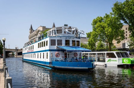 Photo for River Cruise Boat, the Kawartha Voyageur on the Rideau Canal near Parliament Hill, Ottawa, Ontario, Canada on 27 May 2023 - Royalty Free Image