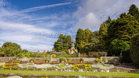 Photo for The Formal Garden and Clock Tower at Cragside, near Rothbury, Northumberland, UK on 24 September 2023 - Royalty Free Image