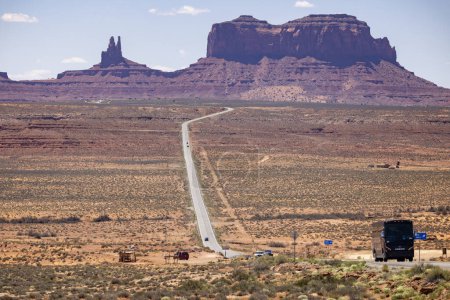 Classic view of Monument valley with Route 163 stretching out in the distance - Forrest Gump point - Utah, USA on 21 April 2024