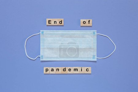 Photo for The inscription The End on the background of a medical mask. End of the coronavirus Covid 19 pandemic - Royalty Free Image