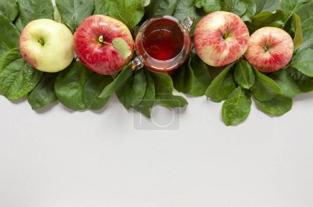 Photo for Apple and honey. Concept for Rosh Hashanah the Jewish New Year. Close up on light blue background. Top view, close up, flat lay - Royalty Free Image