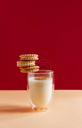 Photo for Glass of milk and round homemade cookies - Royalty Free Image
