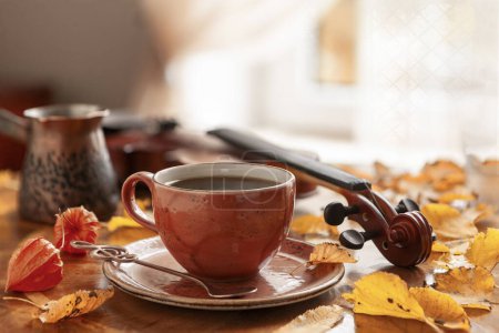 Photo for Cozy autumn photo with a cup of coffee and a violin - Royalty Free Image