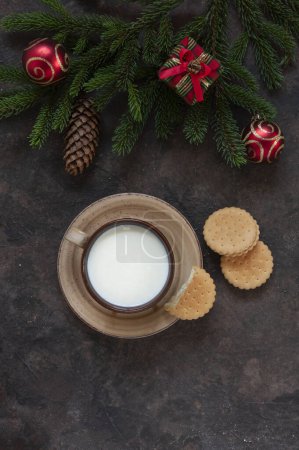 Photo for Christmas background with a cup of milk and homemade cookies for Santa Claus - Royalty Free Image