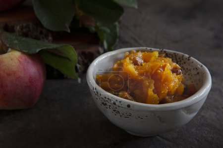 Photo for Homemade apple chutney made from fresh juicy apples. Close-up, selective focus. Traditional Indian food. - Royalty Free Image