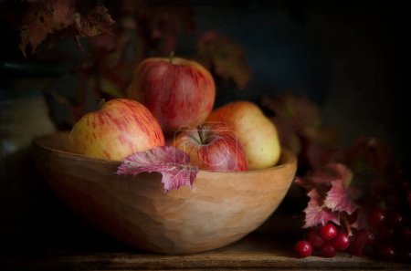 Photo for Still life with applles and scarlet viburnum autumn branches and - Royalty Free Image