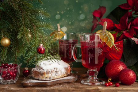 Photo for Christmas composition with two mugs of warming vitamin cranberry drink and stollen. Christmas and New Year home holidays concept. - Royalty Free Image