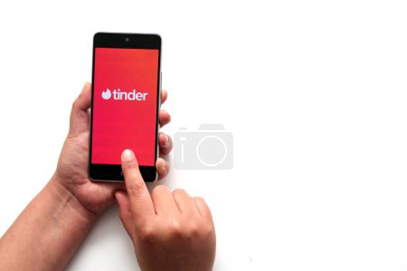 Photo for Mexico City, Mexico - Nov 9 2022: Tinder, the dating app that conquered the world, reports scammers, robberies and extortion in Mexico - Royalty Free Image