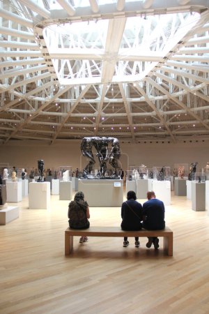 Photo for Mexico City, Mexico - July 19, 2023: Interior of the Soumaya Museum, exhibition room with works by Auguste Rodin that in the center shows the bronze sculpture The Three Shadows - Royalty Free Image