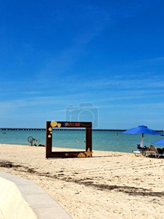 Photo for Progreso, Yucatan, Mexico - Nov 23 2022: Malecon in the peninsula port city is a cruise ship stop on its iconic long pier lined with thatched-roof beaches and restaurants - Royalty Free Image