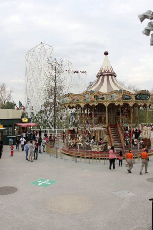 Photo for Mexico City, Mexico - Mar 20 2024: Two-story carousel with moving rides of the Aztlan Urban Park in Chapultepec Forest - Royalty Free Image